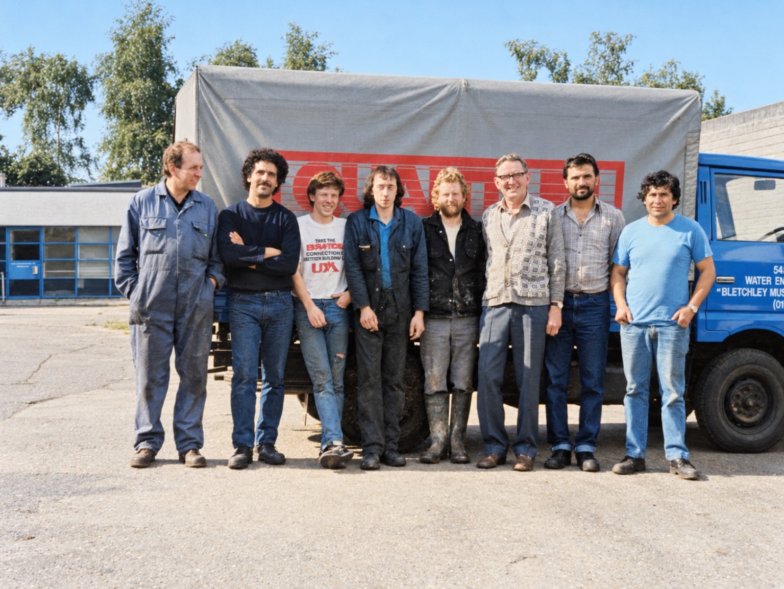 The Quantum Heat Treatment team standing outside beside a company vehicle